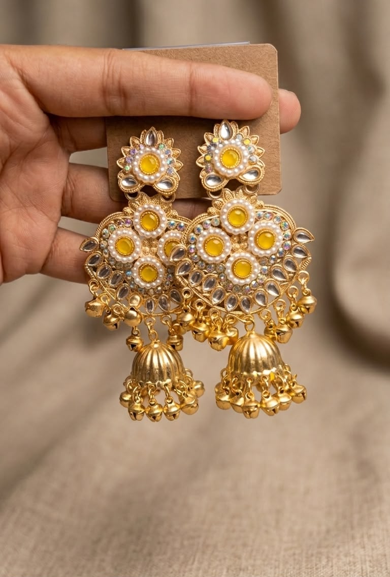 Traditional Gold-Plated Kundan Jhumkas with Emerald Stones, Pearls, and Hanging Ghungroos