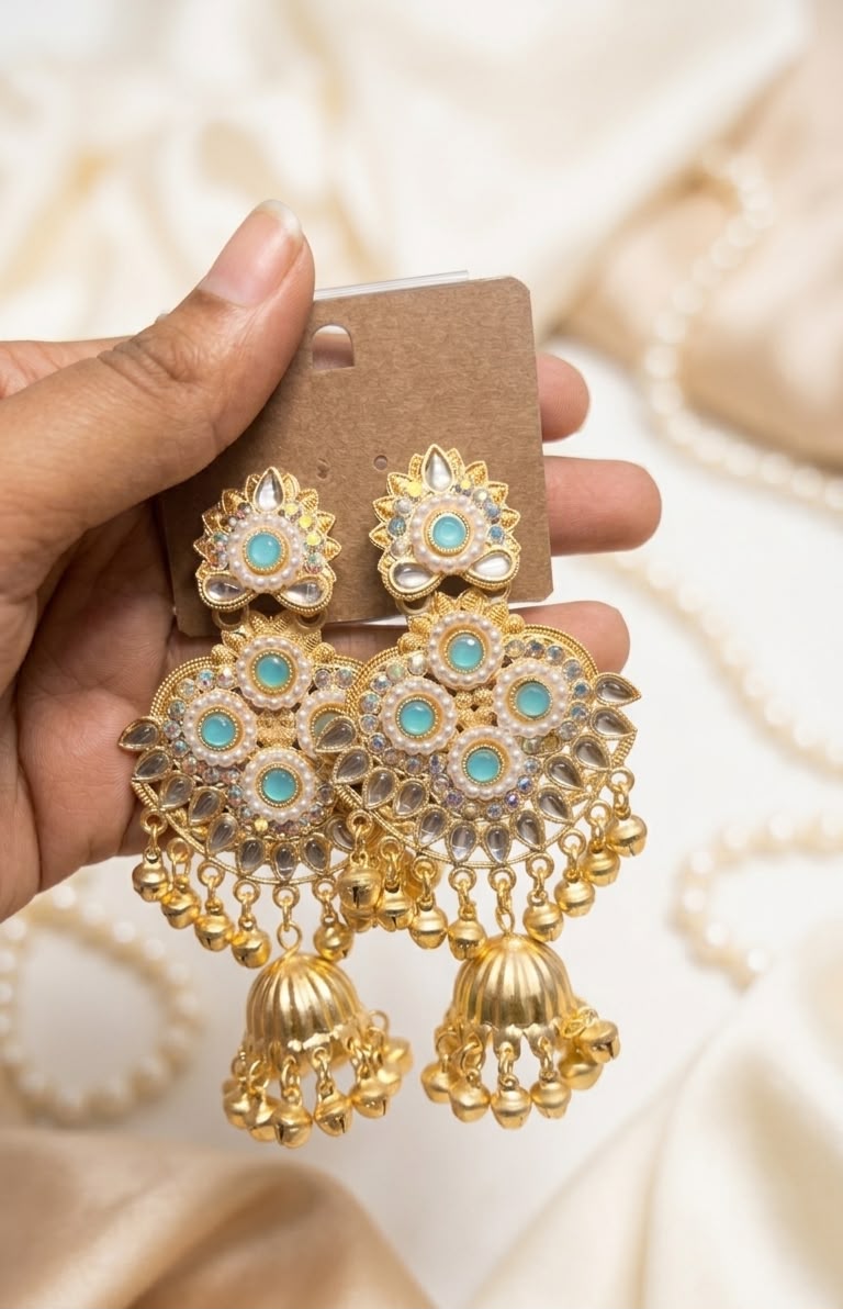 Traditional Gold-Plated Kundan Jhumkas with Emerald Stones, Pearls, and Hanging Ghungroos